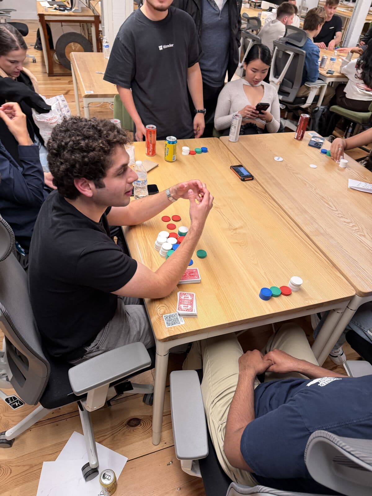 A player talking through a hand behind a stack of chips
